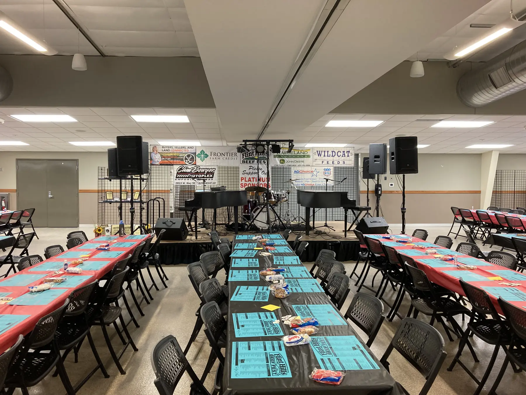 Pianos, drums, and speakers ready for a community event