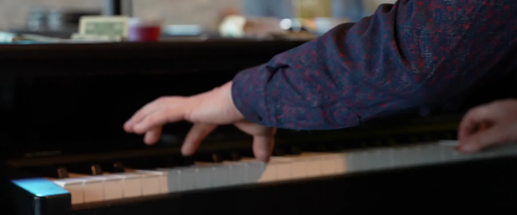 Close-up of a musician playing piano keys